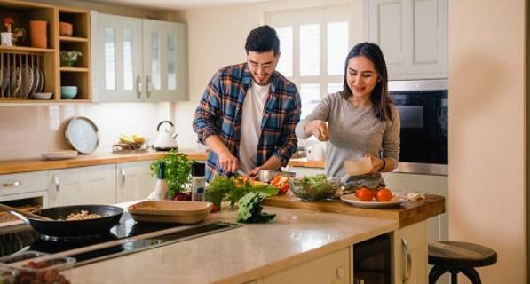 Man and woman cooking in a home kitchen