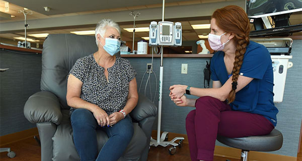 Kathy Leikam with medical staff at St. Vincent Healthcare