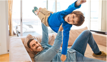 Family playing on a couch