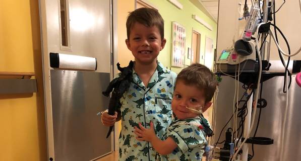 Mason with brother in hospital