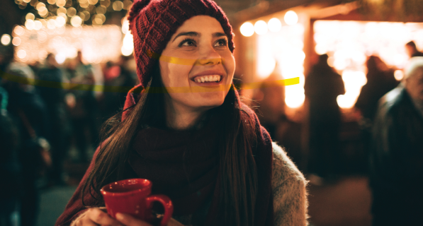 Woman outside drinking in cold weather
