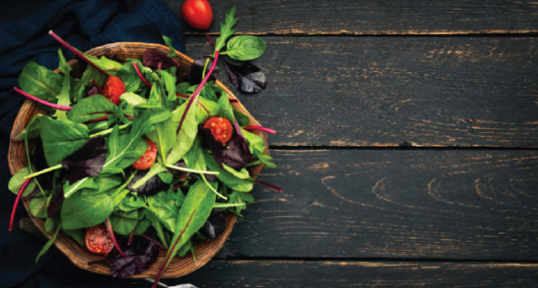 Plate with salad on a table