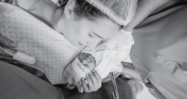 Mother with child in hospital bed