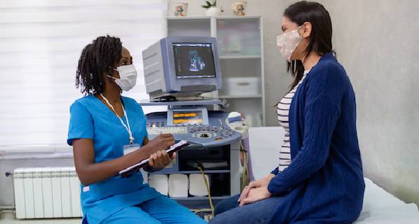 Doctor giving consultation with patient in doctor's office