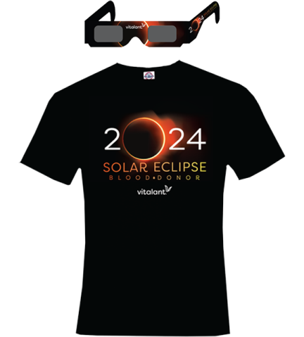 Eclipse glasses above a black shirt that says 2024 Solar Eclipse Blood Donor, branded with the Vitalant logo