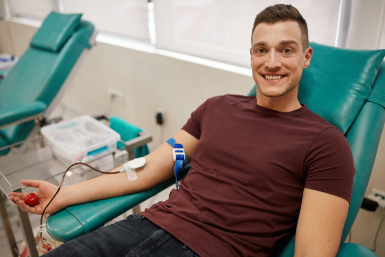 A photo of a man donating blood